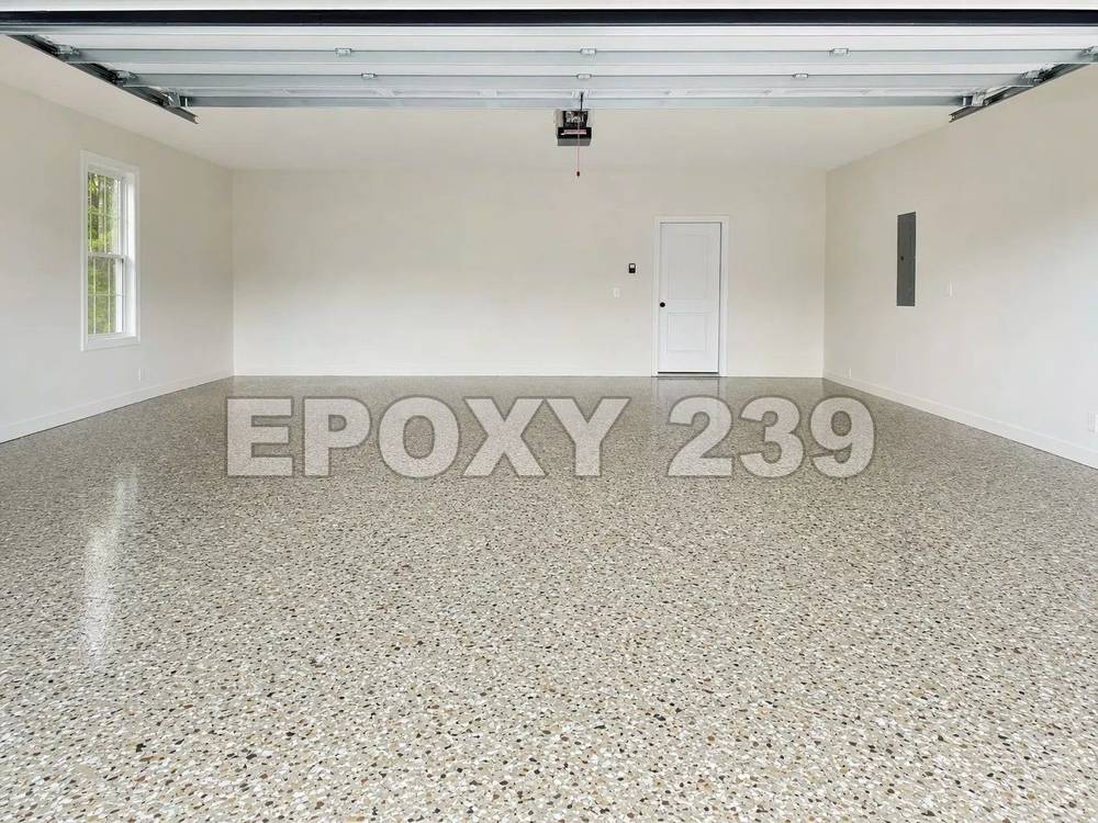 Bright garage with a glossy Creekbed flake epoxy floor