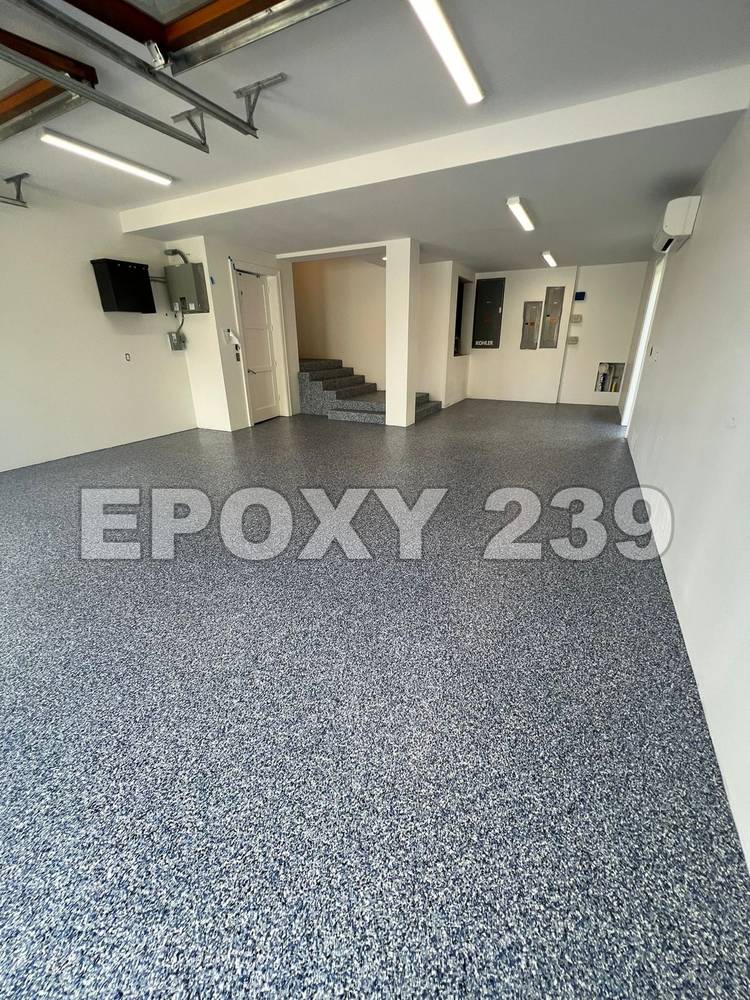 Modern garage with a blue-grey flake epoxy floor