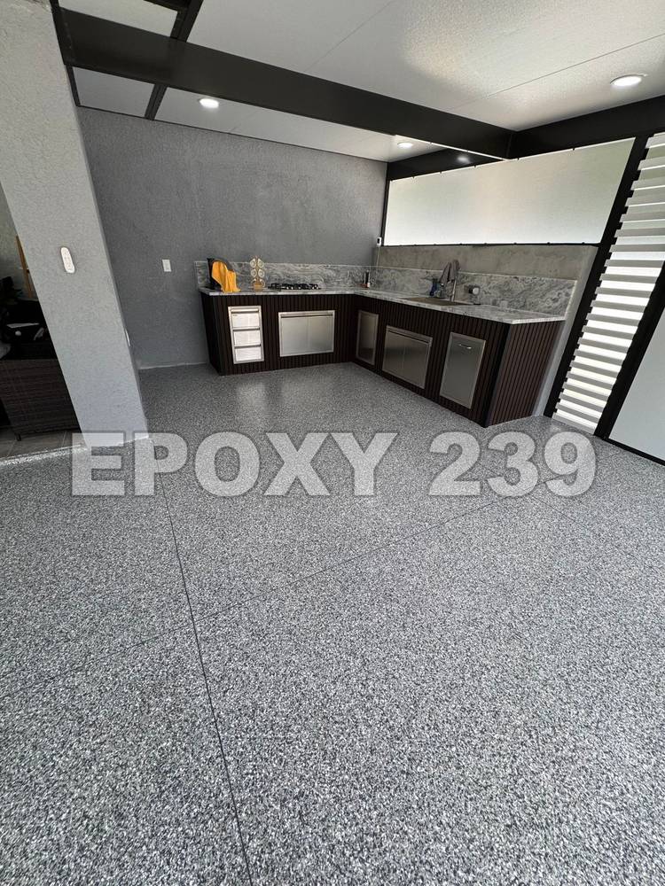 Outdoor kitchen with a grey flake epoxy floor