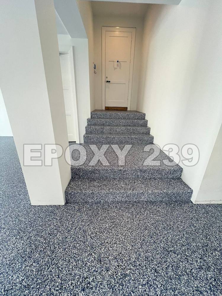 Entry and stairs coated in blue-grey flake epoxy